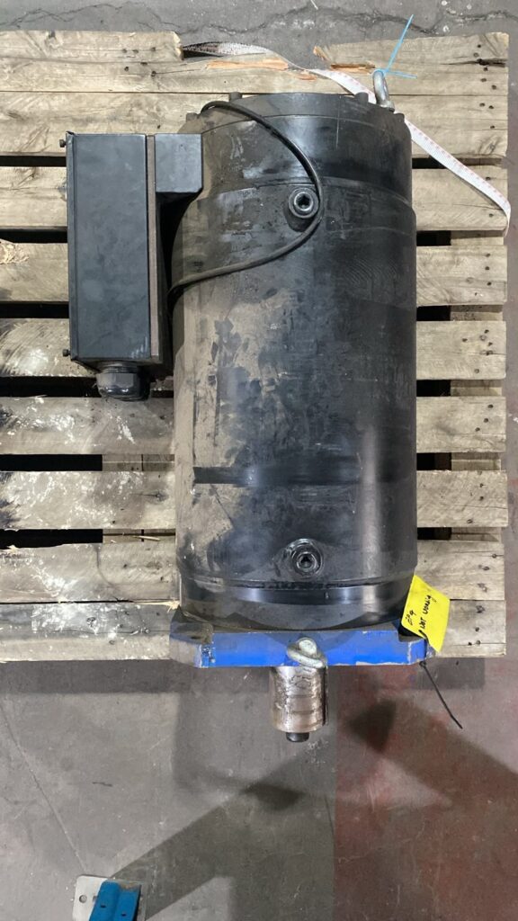 Water-damaged Modrol servo motor on a pallet before repair