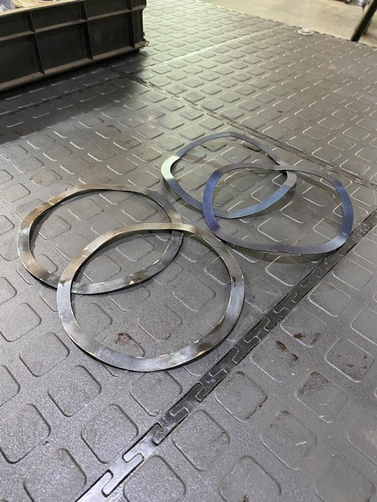 Wave spring washers and shims removed from the servo motor